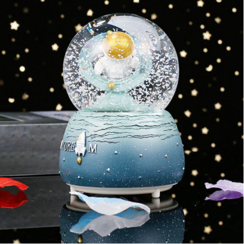 Bola de nieve con música en forma de astronauta    TOY517